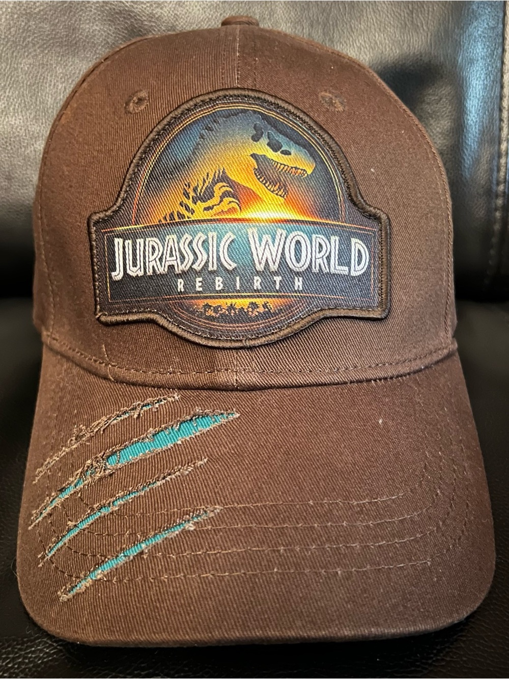 Universal Jurassic World Rebirth Brown Hat with Teal Claw Accents